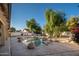 Relaxing pool with large rocks and surrounding landscaping at 7736 W Acoma Dr, Peoria, AZ 85381