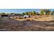 Vacant lot with scattered debris and a van at 7736 W Acoma Dr, Peoria, AZ 85381