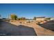 Empty lot with construction debris and van at 7736 W Acoma Dr, Peoria, AZ 85381