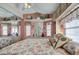 Bedroom with floral bedding, built-in shelving and mirrored closet at 7750 E Broadway Rd # 584, Mesa, AZ 85208