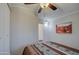 Bright bedroom with ceiling fan, closet, and southwestern decor at 7750 E Broadway Rd # 674, Mesa, AZ 85208