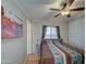 Spacious bedroom with double bed, wood floors and ceiling fan at 7750 E Broadway Rd # 674, Mesa, AZ 85208