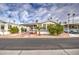 Single-wide home with covered carport and citrus trees at 7750 E Broadway Rd # 674, Mesa, AZ 85208