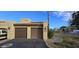 Two-car garage with driveway and nicely landscaped surroundings at 8344 N 21St Dr # I212, Phoenix, AZ 85021