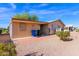 Home's backyard with storage shed, patio, and desert landscaping at 8500 E Southern Ave # 509, Mesa, AZ 85209