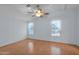 Bright bedroom with light walls, ceiling fan, and wood-look flooring at 8500 E Southern Ave # 509, Mesa, AZ 85209