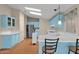 Bright kitchen with light blue cabinets, island with seating, and stainless steel appliances at 8500 E Southern Ave # 509, Mesa, AZ 85209