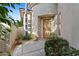 Inviting entryway with a wooden door and terracotta tile flooring at 8760 N 73Rd Way, Scottsdale, AZ 85258