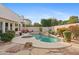 Relaxing pool area with surrounding landscaping and patio furniture at 8760 N 73Rd Way, Scottsdale, AZ 85258