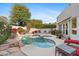 Inviting kidney-shaped pool with flagstone patio and lounge chairs at 8760 N 73Rd Way, Scottsdale, AZ 85258