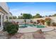 Relaxing kidney-shaped pool with flagstone patio and lounge chairs at 8760 N 73Rd Way, Scottsdale, AZ 85258