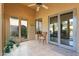 Bright sunroom with access to backyard and a ceiling fan at 8760 N 73Rd Way, Scottsdale, AZ 85258