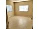 Bright bedroom with tile flooring and neutral walls at 9655 E Edgewood Ave, Mesa, AZ 85208