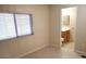 Bright bedroom with window and access to bathroom at 9655 E Edgewood Ave, Mesa, AZ 85208