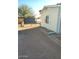 View of home's exterior and gravel yard at 9655 E Edgewood Ave, Mesa, AZ 85208