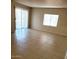 Living room featuring tile flooring and sliding glass doors at 9655 E Edgewood Ave, Mesa, AZ 85208