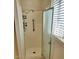 Shower stall with grab bar and sliding glass door at 9655 E Edgewood Ave, Mesa, AZ 85208