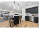 Basement wet bar with seating and modern cabinetry at 9809 E Desert Cove Ave, Scottsdale, AZ 85260