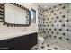 Contemporary bathroom with geometric tile, a modern vanity, and a large mirror at 9809 E Desert Cove Ave, Scottsdale, AZ 85260