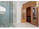 Bathroom with a contemporary wood sauna and geometric tile shower at 9809 E Desert Cove Ave, Scottsdale, AZ 85260