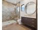 Modern bathroom with a walk-in shower and floating vanity at 9809 E Desert Cove Ave, Scottsdale, AZ 85260