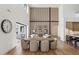 Elegant dining area with a large oval table and comfortable seating at 9809 E Desert Cove Ave, Scottsdale, AZ 85260