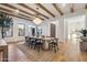 Elegant dining room with a large wooden table, chandelier, and hardwood floors at 9809 E Desert Cove Ave, Scottsdale, AZ 85260