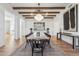 Bright dining room with a long wooden table, chandelier, and hardwood floors at 9809 E Desert Cove Ave, Scottsdale, AZ 85260