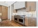 Luxury kitchen features double ovens and marble backsplash at 9809 E Desert Cove Ave, Scottsdale, AZ 85260