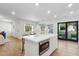 Modern kitchen with island and stainless steel appliances at 9809 E Desert Cove Ave, Scottsdale, AZ 85260