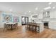 Bright kitchen with white cabinets, island, and dining area at 9809 E Desert Cove Ave, Scottsdale, AZ 85260