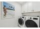 Laundry room with side-by-side washer and dryer at 9809 E Desert Cove Ave, Scottsdale, AZ 85260