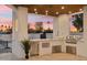 Modern outdoor kitchen with stainless steel appliances and a wood ceiling at 9809 E Desert Cove Ave, Scottsdale, AZ 85260