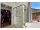 Bathroom with shower, bathtub, and walk-in closet at 9880 E Pine Valley Rd, Scottsdale, AZ 85260