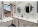 Bathroom features double vanity, soaking tub, and large window at 9880 E Pine Valley Rd, Scottsdale, AZ 85260