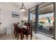 Dining area with sliding glass doors leading to the backyard pool at 9880 E Pine Valley Rd, Scottsdale, AZ 85260