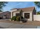 House exterior showcasing a stucco facade and tile roof at 9880 E Pine Valley Rd, Scottsdale, AZ 85260