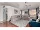 Open living area with hardwood floors and a view into kitchen at 9880 E Pine Valley Rd, Scottsdale, AZ 85260