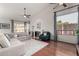 Living room with hardwood floors, fireplace, and ample natural light at 9880 E Pine Valley Rd, Scottsdale, AZ 85260