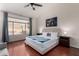 Main bedroom with hardwood floors, a ceiling fan, and sitting area at 9880 E Pine Valley Rd, Scottsdale, AZ 85260