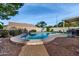 Inviting kidney-shaped pool in backyard at 9880 E Pine Valley Rd, Scottsdale, AZ 85260