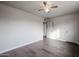 Spacious bedroom with wood-look floors and ceiling fan at 1022 S Lola Ln, Tempe, AZ 85281