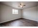 Bright bedroom featuring wood-look flooring and ceiling fan at 1022 S Lola Ln, Tempe, AZ 85281