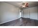 Spacious bedroom with wood-look floors and ceiling fan at 1022 S Lola Ln, Tempe, AZ 85281