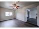 Living room with wood-look floors and access to other rooms at 1022 S Lola Ln, Tempe, AZ 85281