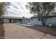 Backyard view showing pool and detached garage at 1022 S Lola Ln, Tempe, AZ 85281