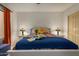 Bright bedroom with a comfortable bed and stylish lamps at 10302 E Lotus Ct, Chandler, AZ 85248