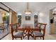 Bright dining room with a wood table and six chairs, offering ample space for entertaining at 10302 E Lotus Ct, Chandler, AZ 85248