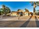 Front view of a single-story house with a two-car garage at 10302 E Lotus Ct, Chandler, AZ 85248