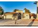 Single-story home with arched entryway and terracotta tile roof at 10302 E Lotus Ct, Chandler, AZ 85248